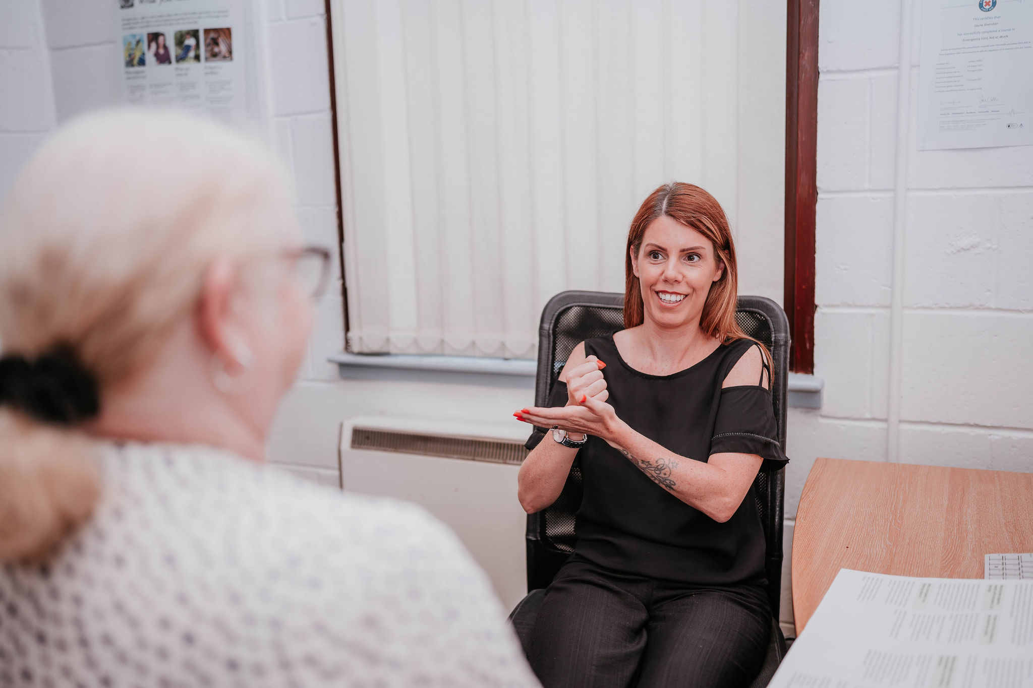 Visitors chatting and connecting at the community drop-in